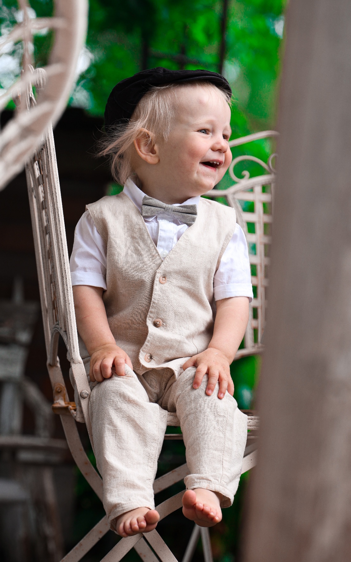 Smiling toddler in linen suit